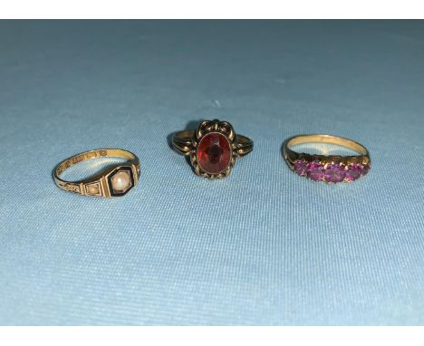 A yellow metal dress ring set 5 amethyst coloured graduating stones, marks worn, tests as 18 ct, 3.2 gm; a 15 carat hallmarke