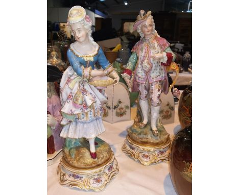 A late 19th century pair of Dresden porcelain figures of a beau and his lass, 40 cm 