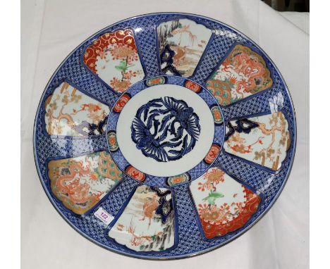 An impressive 19th century Japanese Imari porcelain saucer dish of large size decorated in underglaze blue with enamelled pan