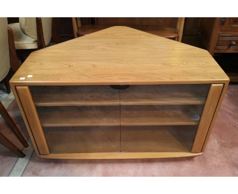 A modern Ercol lightwood corner television unit with double glazed doors under, 71 cm deep 