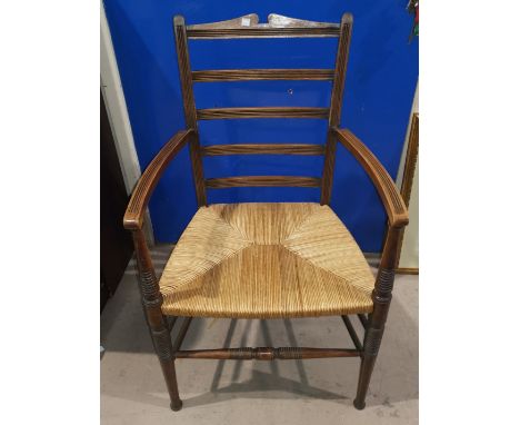 A ladder back chair with rush seat; a pine 3 height chest of drawers 