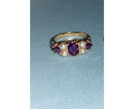 A 9 carat hallmarked gold dress ring set amethyst and seed pearl in the Victorian style, 3.1 gm;