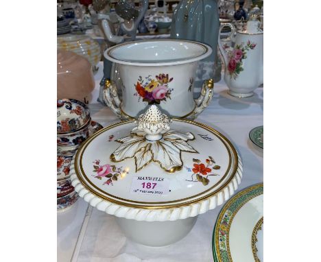 A covered porcelain ice pail, classical urn shaped with detachable lid and liner, hand painted with flowers in polychrome 