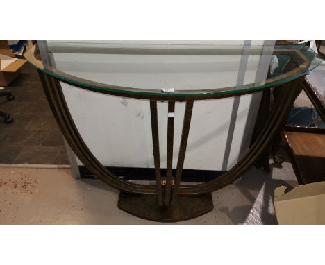 An Art Deco style console table in gilt metal with glass top 