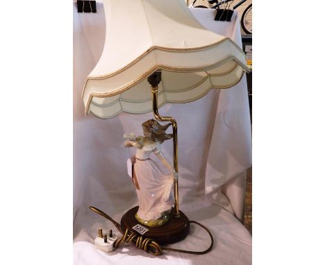 Figural table lamp on wooden base, H: 65 cm. All electrical items in this lot have been PAT tested for safety and have passed