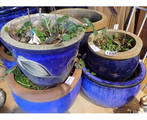 Seven blue glazed ceramic plant pots, largest D: 40 cm. Not available for in-house P&amp;P 