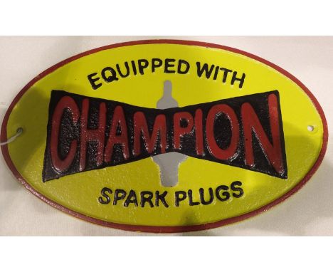 Cast iron Champion Spark Plugs sign, W: 30 cm. P&amp;P Group 1 (£14+VAT for the first lot and £1+VAT for subsequent lots) 