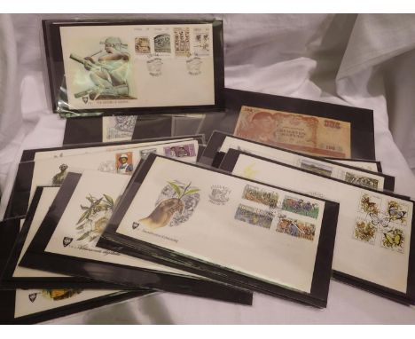 Collection of world banknotes in sleeves and first day covers. P&amp;P Group 1 (£14+VAT for the first lot and £1+VAT for subs
