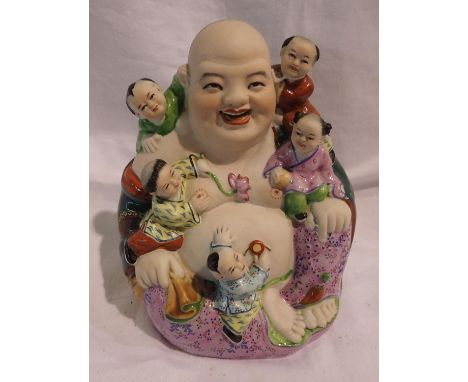 20th century Chinese Porcelain figure of Buddha with five children playing around him, impressed marks to base, H: 16 cm. P&a