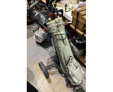 Motocaddy P1 golf caddy with gold bag and two putters. Not available for in-house P&amp;P 
