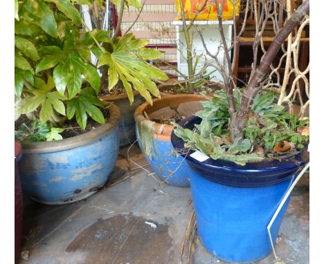 Four blue glazed ceramic pots, largest H: 40 cm. Not available for in-house P&amp;P 