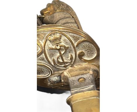 Antique naval officer's sword featuring a lion pommel and crowned anchor emblem. Manufactured by Henry Wilkinson, Pall Mall, 