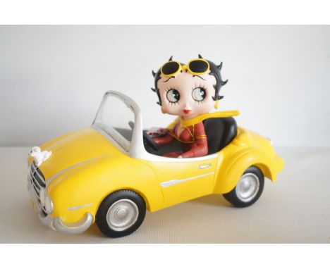 Betty Boop in yellow sports car 