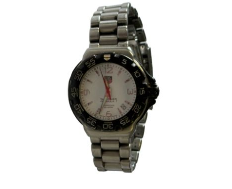 Tag Heuer formula 1 professional wristwatch, date app at 4 o clock. Black bezel & white dial, currently ticking & keeping goo