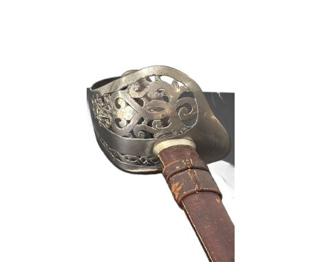 Antique British steel sword with ornate basket hilt, featuring intricate scrollwork and emblem. Includes etched blade with de