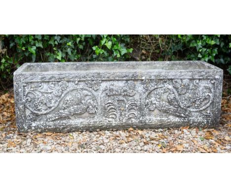 A cast reconstituted stone trough with fruiting vine and peacock ornament, 120cm wide x 38.5cm deep x 35cm highHairline crack