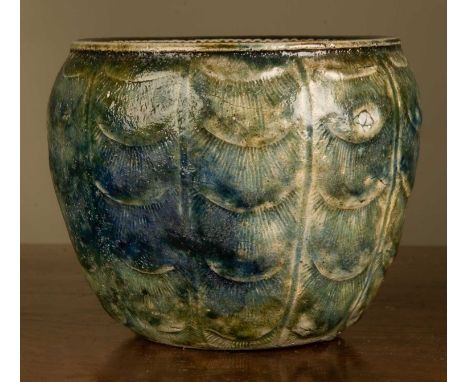 A Martin Brothers ovoid vase, with peacock feather-style decoration, signed to the base 'Martin Bro, Southall, 1 - 1915', 10.