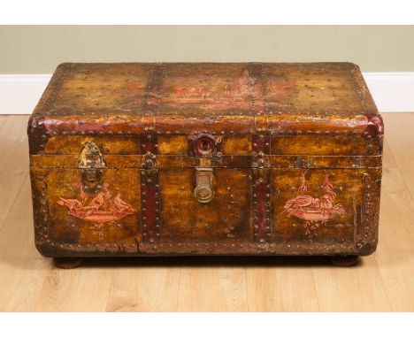 An old painted travelling trunk, with studded tin covering and a lid decorated with a classical scene with sculpture and catt
