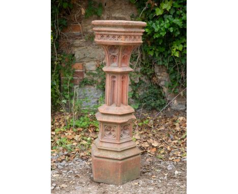 A Gothic-style cast terracotta coloured sundial plinth, with blind fretwork decoration, 29cm wide at the top, 91cm highWeathe