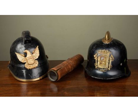 A five draw military brass leather bound telescope, 81cm long fully extended; together with two antique fire helmets; a Danis