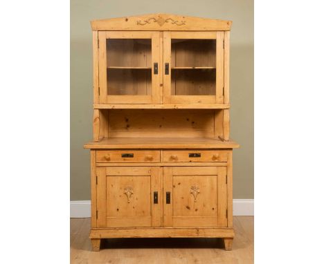 A continental pine dresser, 127cm wide x 61cm deep x 197.5cm highMinor marks, dents and scratches due to age and use, no lock