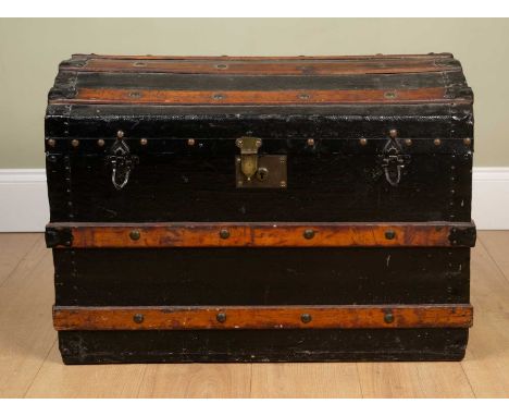 A wooden and wrought iron bound dome topped trunk with striped lined interior, 76cm wide x 48cm deep x 54cm highDents, marks 
