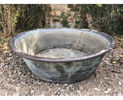An old circular copper basin, 83cm diameter x 24cm highSome dents and marks overall, and oxidisation due to age and use.