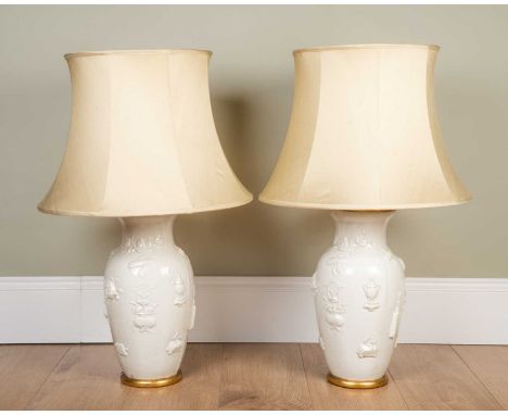 A pair of Vaughan table lamps, in the Chinese Blanc de Chine style and on gilt bases, the vases 39cm high and 19cm diameter, 