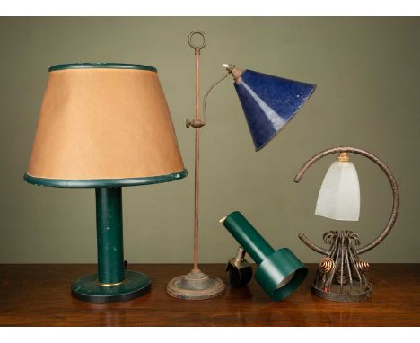 A group of four various table lamps consisting of; a green leather ground table lamp with parchment shade, 50cm high; an iron