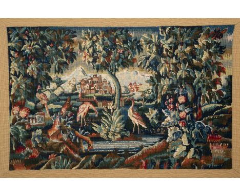 A needlework tapestry picture depicting flamingos in an extensive garden with a country house in the background, framed, 112c
