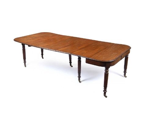 A George IV mahogany 'D' end extending dining table with Wilkinson style concertina action, the top with a moulded edge above