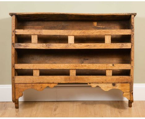 An antique Scottish shelf, of rustic form, 112cm wide, 25cm deep, 89cm highMinor marks due to the rustic construction, of lat