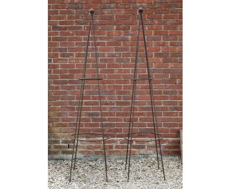 A pair of wrought iron conical garden rose supports, both with a ball finial, standing 206cm highOxidised overall.