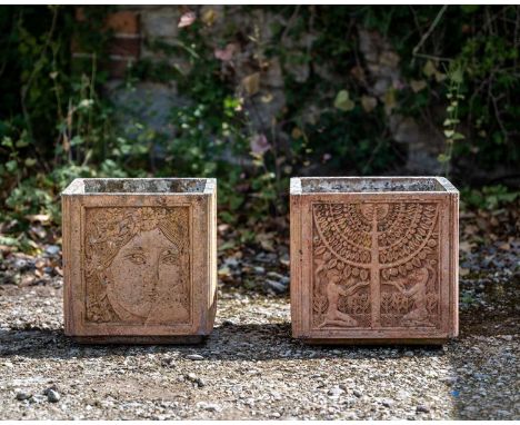 Two similar cast terracotta cubic garden planters, one decorated with foliage, the other with female masks, 31cm wide x 29cm 