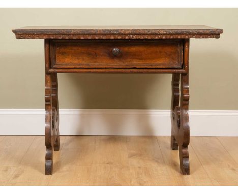 An antique Spanish walnut side table, a rectangular top over a frieze drawer and with pierced shaped end supports, 101cm wide