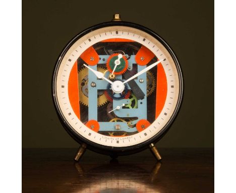 A Liberty of London vintage alarm clock with exposed multicoloured working within black case, 10cm diameterSome scratches to 