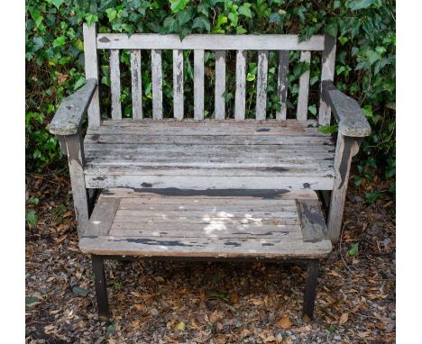 A small teak garden bench with flat arms, 132cm wide x 89cm high together with a small teak rectangular topped garden table, 