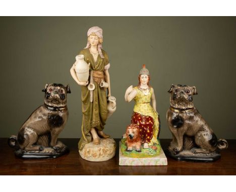 A Royal Dux porcelain figurine, of 'The Water Carrier', 50cm high; together with a pair of Staffordshire ceramic fire pugs, 2
