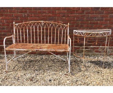 A white painted iron garden bench with strapwork seat and pointed arch back, 120cm wide x 46cm deep x seat height 45cm; toget