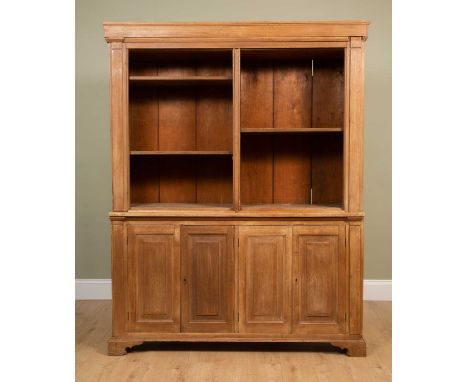 A pine dresser with adjustable shelves over two pairs of cupboard doors, all on bracket feet, 154cm wide x 44cm deep x 201cm 