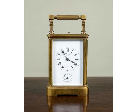 A French brass cased carriage clock retailed by J. W. Benson, 28 Royal Exchange, with platform escarpment, push repeat alarm,