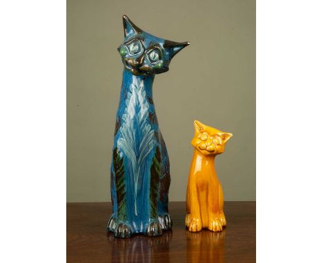 Brannam ceramic blue cat signed to the base 'C. H. Brannam', dated 1902, 34cm high, together with a similar orange ceramic ca