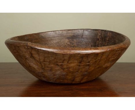 An antique turned sycamore dairy bowl, with old splits and old wrought iron patch, 42cm diameterThis rustic bowl is in used c