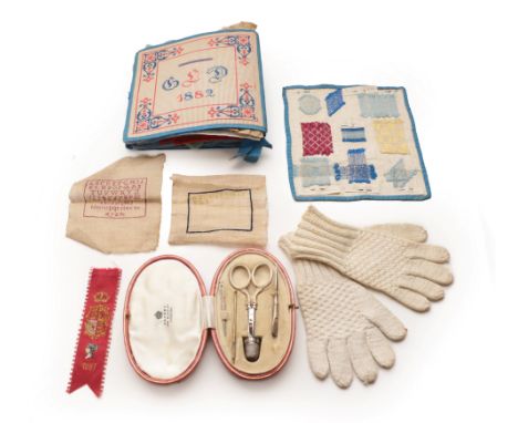 A School Girl's Sewing Sample Book, initialled 'GLD' and dated 1882, front and back covers worked in yellow and red threads, 