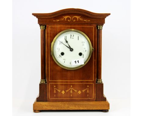 An Edwardian inlaid mahogany striking mantel clock, H. 34cm.