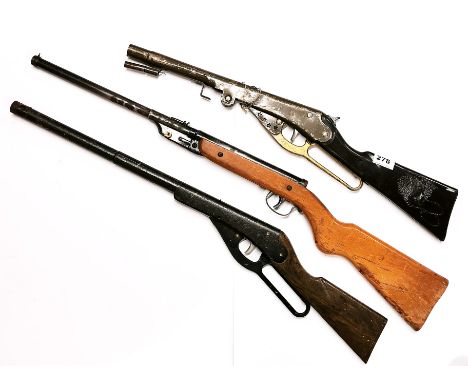 A vintage air rifle and two toy guns.