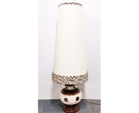 A 1960's ceramic floor lamp and original shade, H. 113cm.