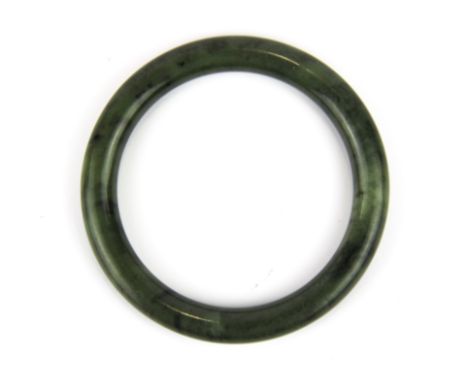 A fine spinach jade bangle, Dia. 9mm. Internal Dia. 5.8cm.