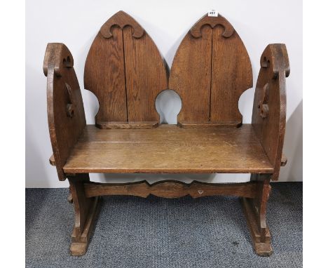 A 19th century gothic style oak hall bench, 86cm x 94cm.