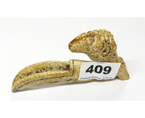 A Chinese carved archaic form brown jade/hardstone goat head libation ladle, L. 12cm.
